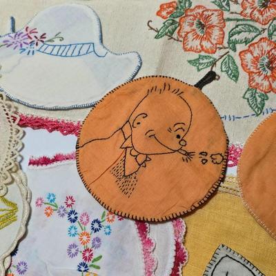 Assortment of embroidered cloth - flowers, cats and other cute patterns