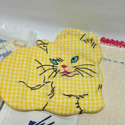 Assortment of embroidered cloth - flowers, cats and other cute patterns