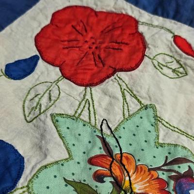 Two handmade quilted fabric pieces -