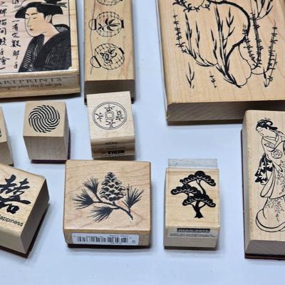Stamps mounted on wood blocks - mostly Asian themed - bamboo - letters- and more