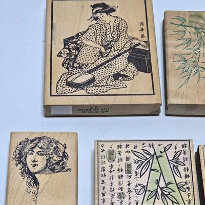 Stamps mounted on wood blocks - mostly Asian themed - bamboo - letters- and more
