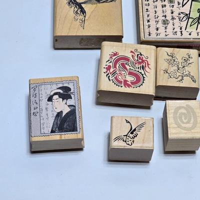Stamps mounted on wood blocks - mostly Asian themed - bamboo - letters- and more