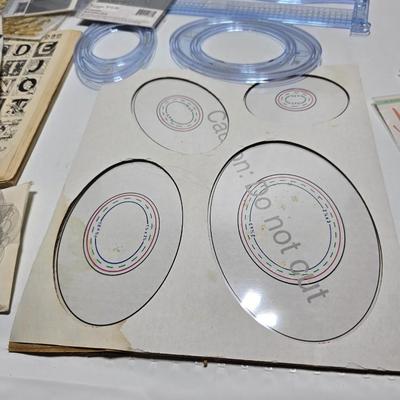 Box of crafting supplies - stencils - die cuts - scissors and more
