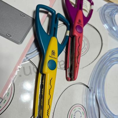 Box of crafting supplies - stencils - die cuts - scissors and more