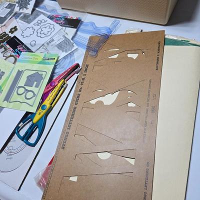 Box of crafting supplies - stencils - die cuts - scissors and more
