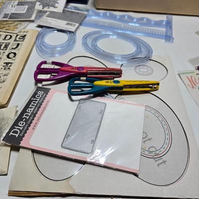 Box of crafting supplies - stencils - die cuts - scissors and more
