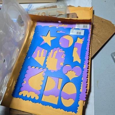 Box of crafting supplies - stencils - die cuts - scissors and more