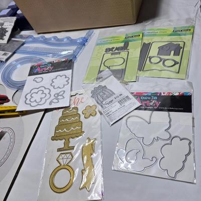 Box of crafting supplies - stencils - die cuts - scissors and more