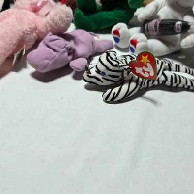 Huge assortment of plush characters - Disney - Looney toons - Barney % friends - animals - Ty and more