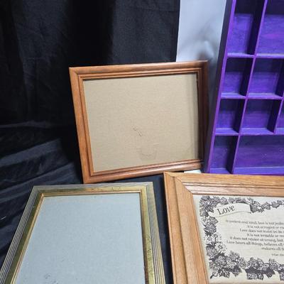 Small trinket shelves, picture frames, and a wall clock