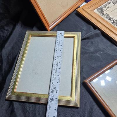 Small trinket shelves, picture frames, and a wall clock