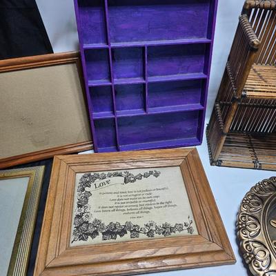 Small trinket shelves, picture frames, and a wall clock
