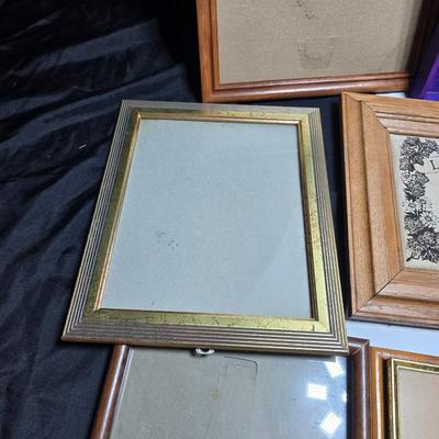 Small trinket shelves, picture frames, and a wall clock