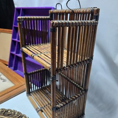 Small trinket shelves, picture frames, and a wall clock