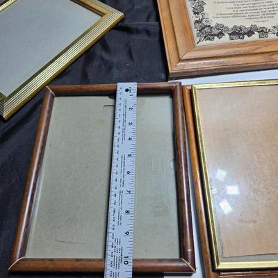 Small trinket shelves, picture frames, and a wall clock