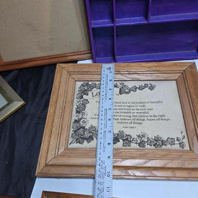 Small trinket shelves, picture frames, and a wall clock