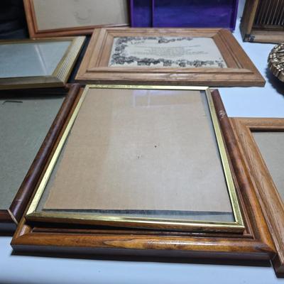 Small trinket shelves, picture frames, and a wall clock