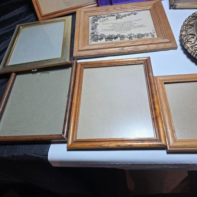 Small trinket shelves, picture frames, and a wall clock