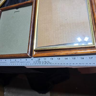 Small trinket shelves, picture frames, and a wall clock