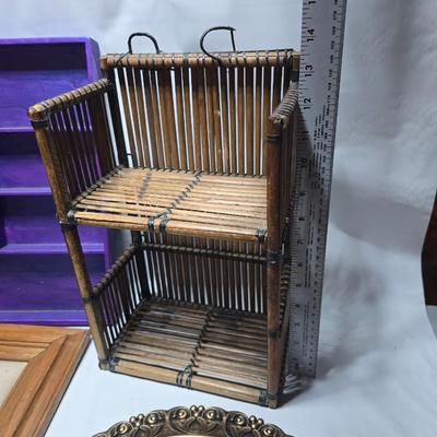 Small trinket shelves, picture frames, and a wall clock