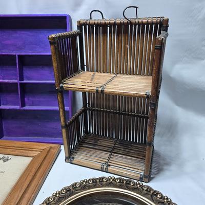 Small trinket shelves, picture frames, and a wall clock