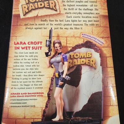 Playmates Toys Tomb Raider Lara Croft in Wet Suit with Two Removable Pistols Harpoon Gun and Diorama Display Base Action Figure