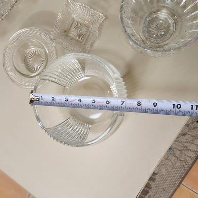 Table lot of Clear Glass Crystal Bowls Candle Holders ,Glasses, Waterford , Reed & Barton Drinking Glasses ,Queen Mary 2 , and others