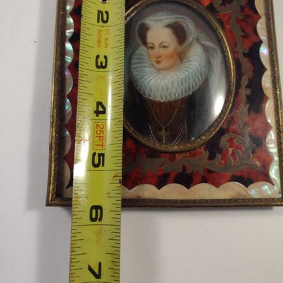 Sale Photo Thumbnail #421: Antique Miniature Portrait in Boulle Work Frame with Convex Bubble Glass and Mother of Pearl Inlay- Approx 4 3/4" x 5 5/8".  Image is possibly of Mary Stuart, Queen of Scots.  Frame stand not included.
