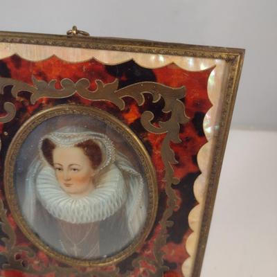 Sale Photo Thumbnail #418: Antique Miniature Portrait in Boulle Work Frame with Convex Bubble Glass and Mother of Pearl Inlay- Approx 4 3/4" x 5 5/8".  Image is possibly of Mary Stuart, Queen of Scots.  Frame stand not included.
