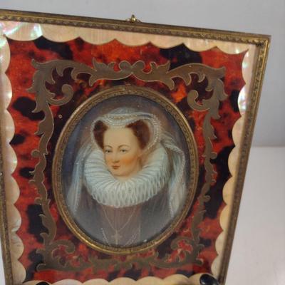 Sale Photo Thumbnail #419: Antique Miniature Portrait in Boulle Work Frame with Convex Bubble Glass and Mother of Pearl Inlay- Approx 4 3/4" x 5 5/8".  Image is possibly of Mary Stuart, Queen of Scots.  Frame stand not included.