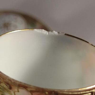 Sale Photo Thumbnail #477: Vintage Hand Painted Nippon Condiment Set- Seven Pieces.  Cup has chipping at rim- please see all pictures for condition.