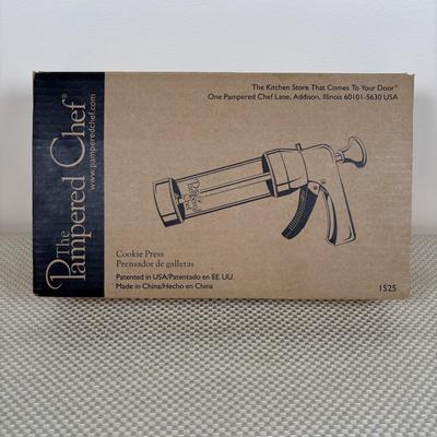 LOT 95: Bakers Delight: Pamper Chef Cookie Press, Longaberger Yellow Pie Plate, Spring Form Pan, Autum Cake-lite Pan, Wilton Round Pans,...