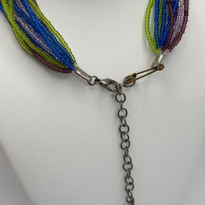 LOT 104: Beaded Necklace Collection Featuring an Art Glass Pendant along with 2 Pair of Dangle Earrings