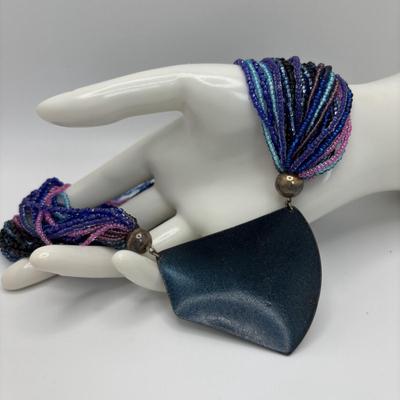 LOT 104: Beaded Necklace Collection Featuring an Art Glass Pendant along with 2 Pair of Dangle Earrings