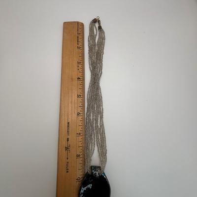 LOT 104: Beaded Necklace Collection Featuring an Art Glass Pendant along with 2 Pair of Dangle Earrings