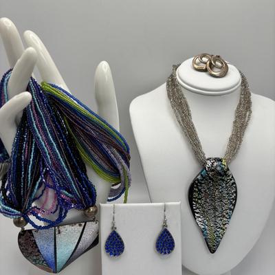 LOT 104: Beaded Necklace Collection Featuring an Art Glass Pendant along with 2 Pair of Dangle Earrings