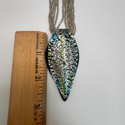 LOT 104: Beaded Necklace Collection Featuring an Art Glass Pendant along with 2 Pair of Dangle Earrings