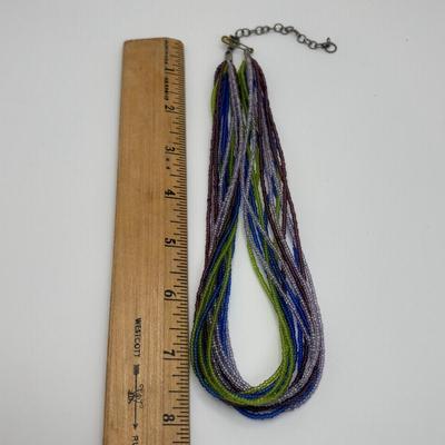 LOT 104: Beaded Necklace Collection Featuring an Art Glass Pendant along with 2 Pair of Dangle Earrings