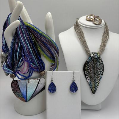 LOT 104: Beaded Necklace Collection Featuring an Art Glass Pendant along with 2 Pair of Dangle Earrings