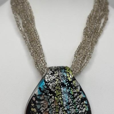 LOT 104: Beaded Necklace Collection Featuring an Art Glass Pendant along with 2 Pair of Dangle Earrings