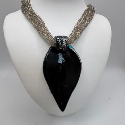 LOT 104: Beaded Necklace Collection Featuring an Art Glass Pendant along with 2 Pair of Dangle Earrings