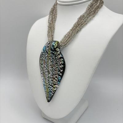 LOT 104: Beaded Necklace Collection Featuring an Art Glass Pendant along with 2 Pair of Dangle Earrings