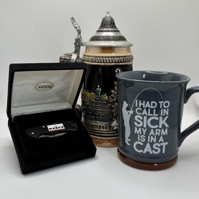 LOT 128: Zippo Maxon Pocket Knife, German Beer Stein and Fishing Coffee Mug