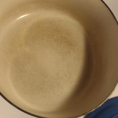 Sale Photo Thumbnail #546: Le Creuset Enameled Cast Iron Dutch Oven with Lid- Size 'E' 4 1/2 Quart Capacity.  Item is used and has some discoloration of interior, but appears to be in good condition.