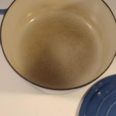 Sale Photo Thumbnail #544: Le Creuset Enameled Cast Iron Dutch Oven with Lid- Size 'E' 4 1/2 Quart Capacity.  Item is used and has some discoloration of interior, but appears to be in good condition.