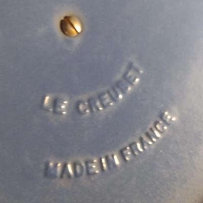 Sale Photo Thumbnail #545: Le Creuset Enameled Cast Iron Dutch Oven with Lid- Size 'E' 4 1/2 Quart Capacity.  Item is used and has some discoloration of interior, but appears to be in good condition.