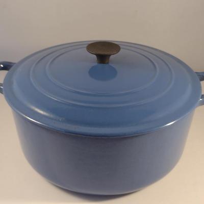 Sale Photo Thumbnail #543: Le Creuset Enameled Cast Iron Dutch Oven with Lid- Size 'E' 4 1/2 Quart Capacity.  Item is used and has some discoloration of interior, but appears to be in good condition.