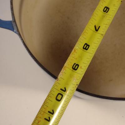 Sale Photo Thumbnail #548: Le Creuset Enameled Cast Iron Dutch Oven with Lid- Size 'E' 4 1/2 Quart Capacity.  Item is used and has some discoloration of interior, but appears to be in good condition.