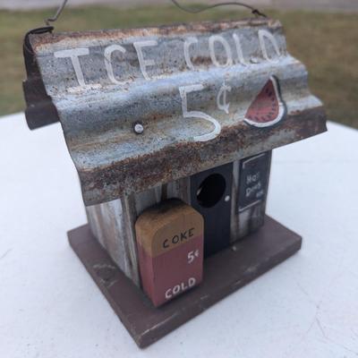 Small hanging birdhouse with metal roof