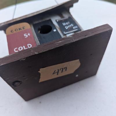 Small hanging birdhouse with metal roof